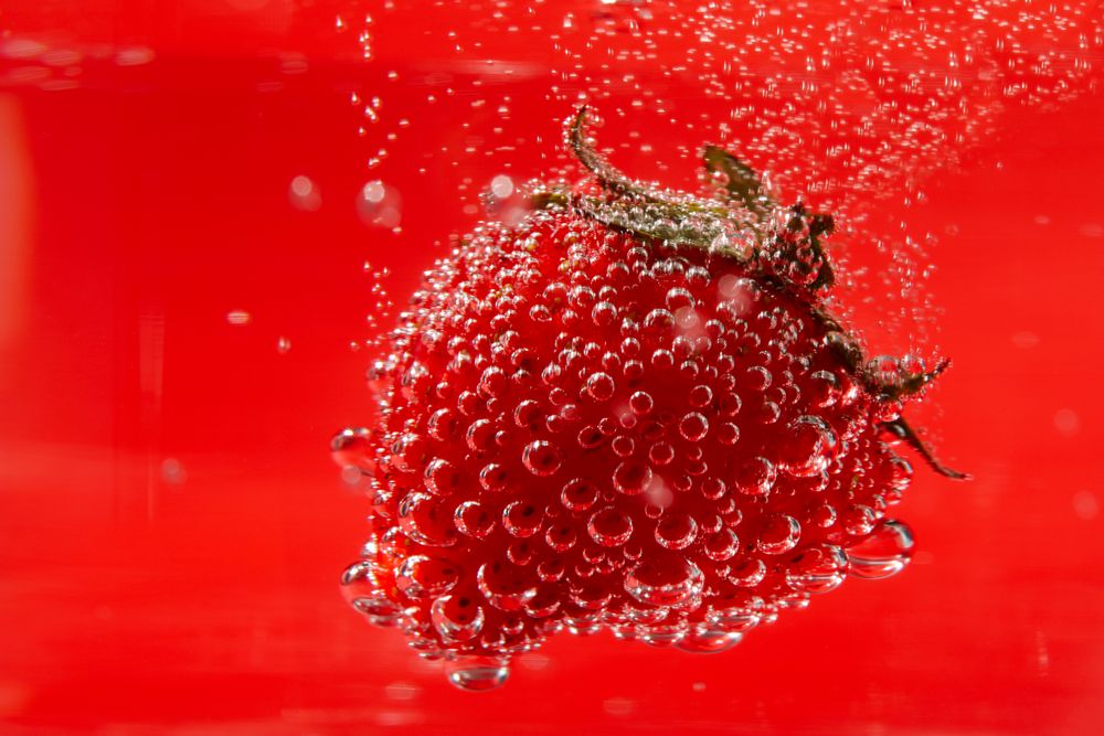 Close up of strawberry submerged in water