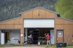 Three people working in a garden shop in the Rocky Mountains