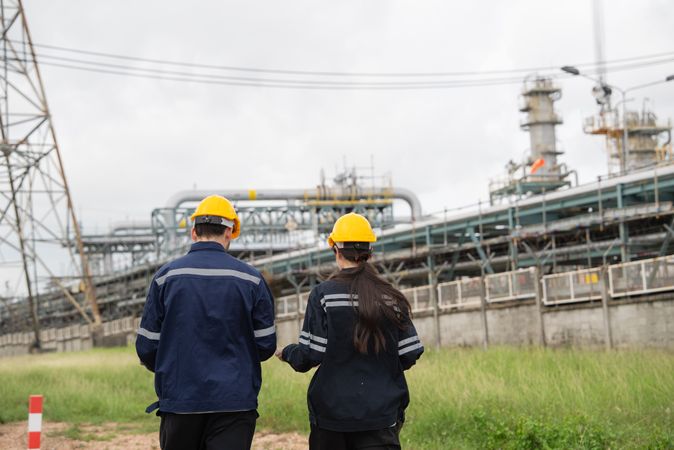 Engineer worker checking project at petrochemical factory or refinery oil plant industrial.
