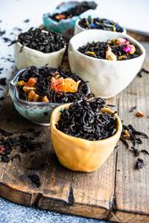 Variety of loose leaf tea on bread board
