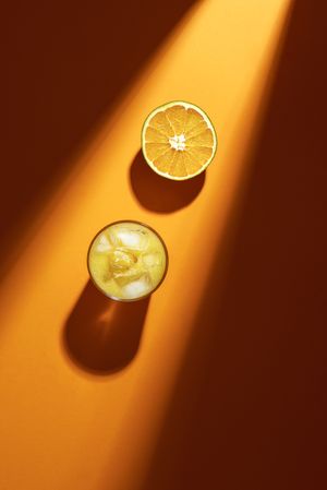 Glass of orange juice in sunlight