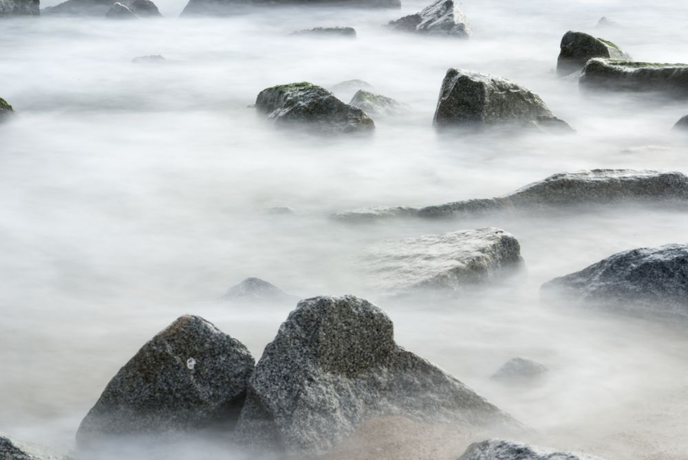 Ocean Mist Seascape of Water Rushing through Rocks