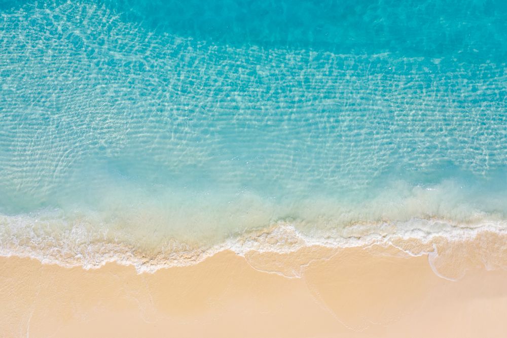 Aerial landscape shot of clear blue ocean waters