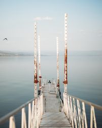 Rusty pier near calm sea