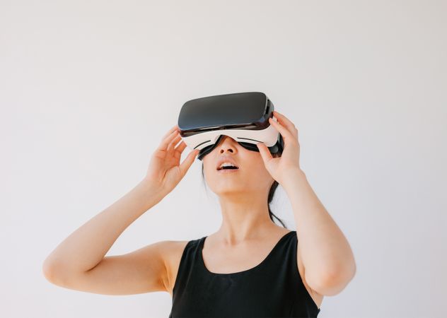Woman using the virtual reality headset and looking away