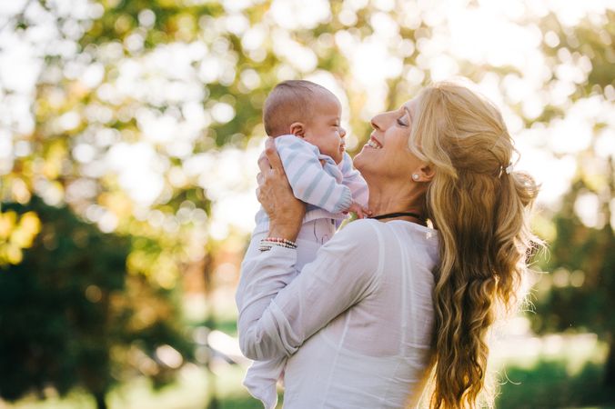 grandmother holding her grandson with down syndrome