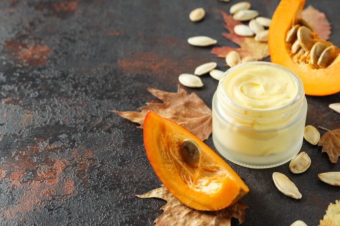 Skin care and face care concept - pumpkin cosmetic