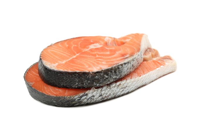 Fresh raw salmon meat isolated on light background