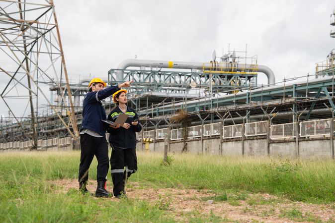 Engineer worker checking project at petrochemical factory or refinery oil plant industrial.