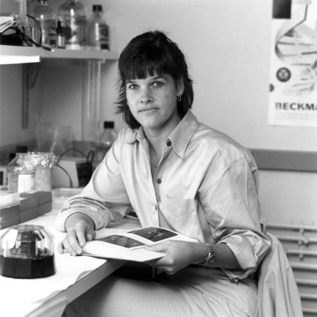 Bethesda, MD - USA, October 1985: Female scientist with book in laboratory