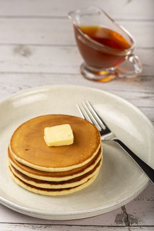 Delicious pancakes with butter and honey.
