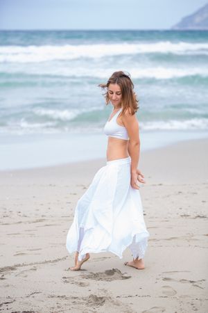 woman dancing near sea
