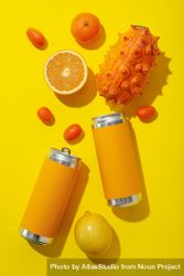Tropical fruit and tin cans on yellow background, top view 4OdRBv