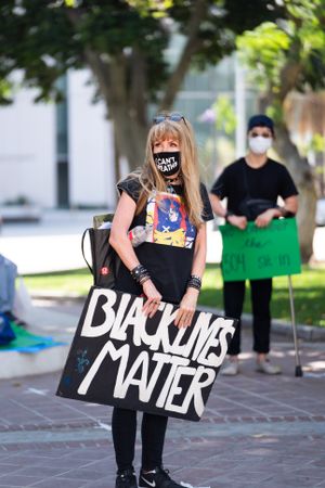 Los Angeles, CA, USA — June 16th, 2020: woman standing at solidarity rally