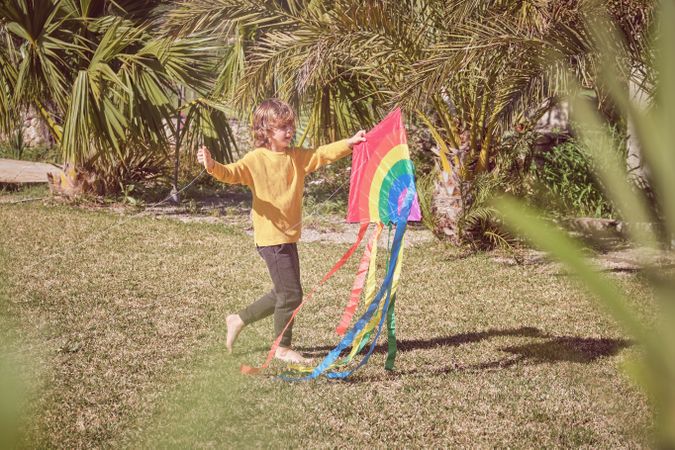 Little boy with rainbow kite