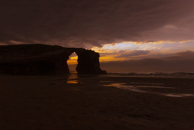 Beautiful evening sky over waving sea and shore