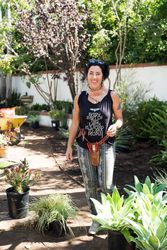 Woman smiling while standing in the garden