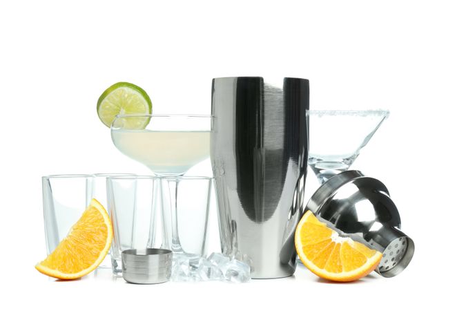 Concept of preparing alcohol drink or cocktail, shaker, isolated on plain background