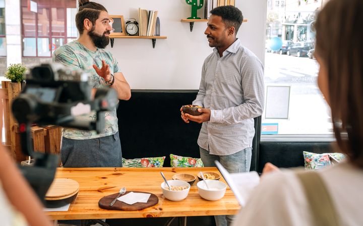 Cook and presenter speaking during a live program