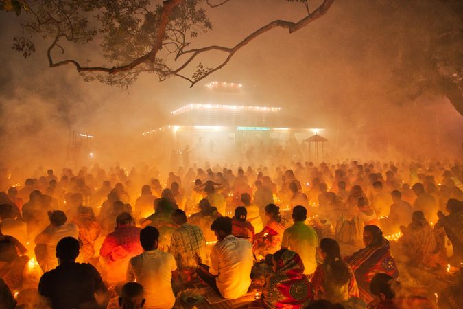 People gathering outdoor at night attending Hindu religious festival Rakher Upobash in Narayanganj, Bangladesh