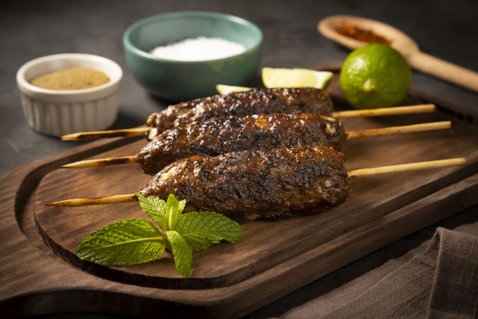 Beef kafta on the wooden board. Kafta, Traditional Arabic cuisine.