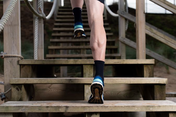 Sportsman running on stairs