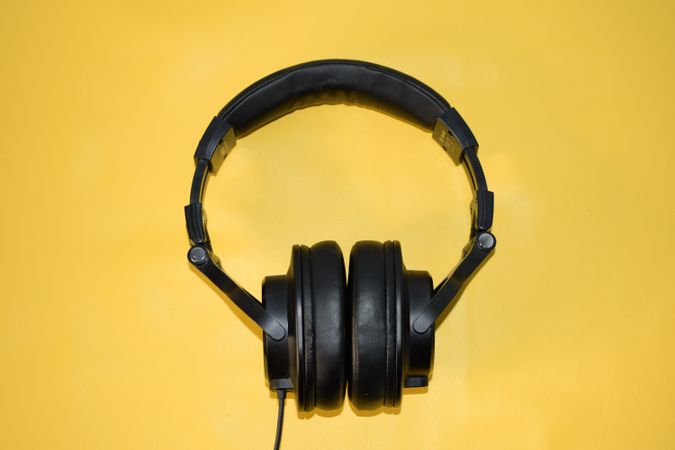 Headphones in yellow studio shoot