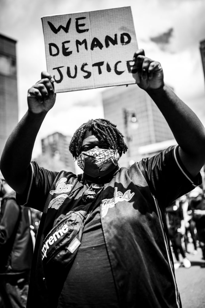 MONTREAL, QUEBEC, CANADA – June 7 2020- protester holding a sign during a Black Lives Matter protest