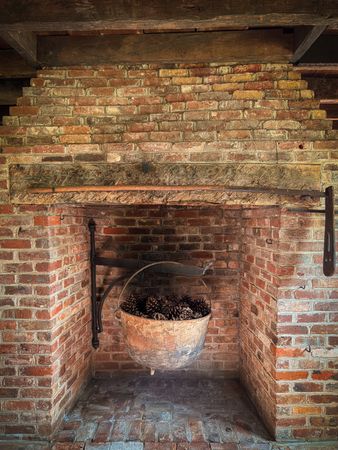 Cast iron cauldron in fireplace