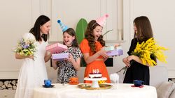 Family celebrating at birthday party with presents
