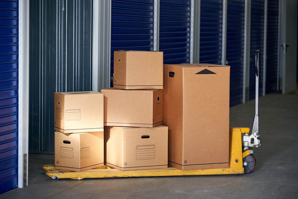 Storage in an industrial building for rental to entrepreneurs or individuals with recyclable cardboard boxes on top of a pallet rack
