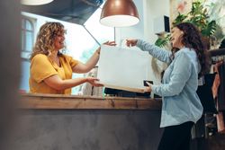 Woman buying clothes in a fashion store