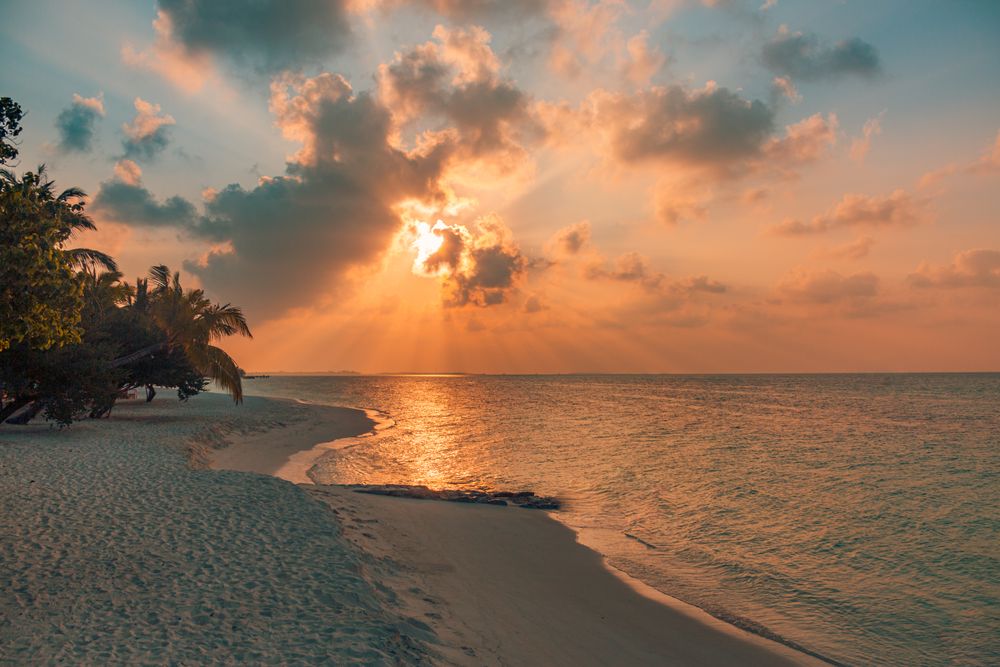 Peach tones in a sunset over the Indian Ocean from a beach, landscape