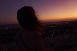 Silhouette of female enjoying picturesque sunset