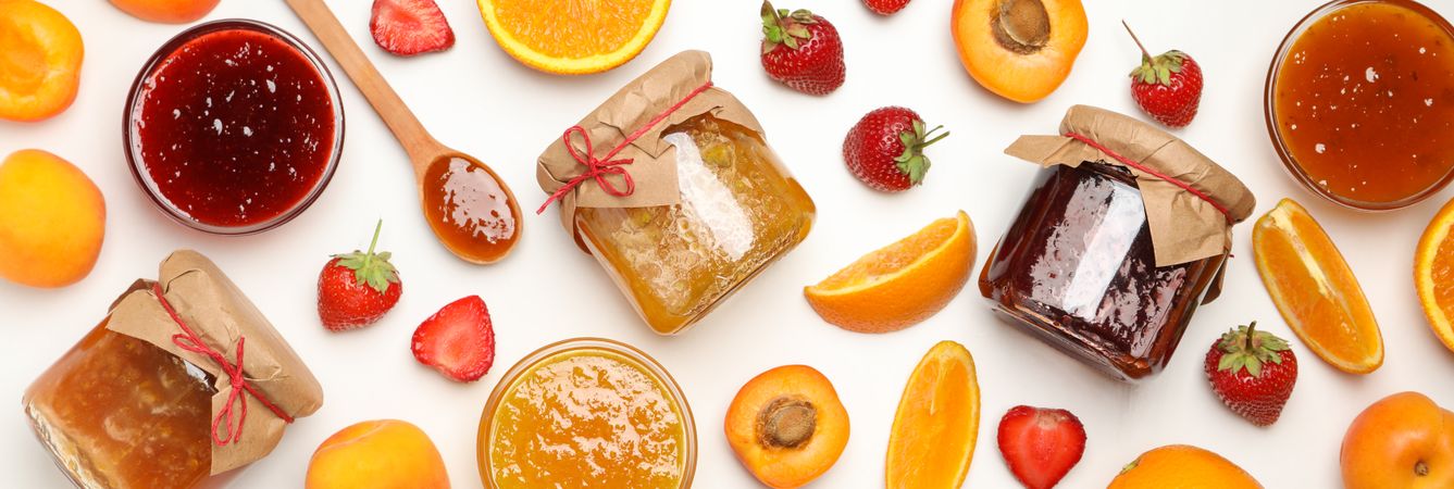 Composition with jam and ingredients on plain background, top view