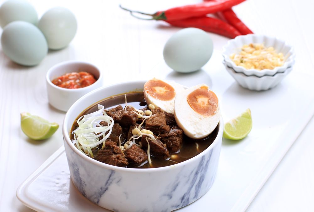 Bowl of Rawon, Indonesian Beef Soup Dish With Egg