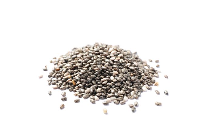 Heap of chia seeds isolated on blank background