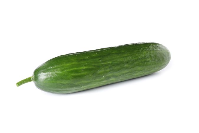 Ripe green cucumber isolated on blank background