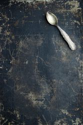 Teaspoon over dark grunge background