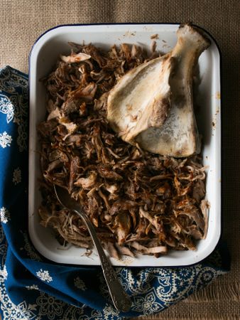 Container with puller pork and bone