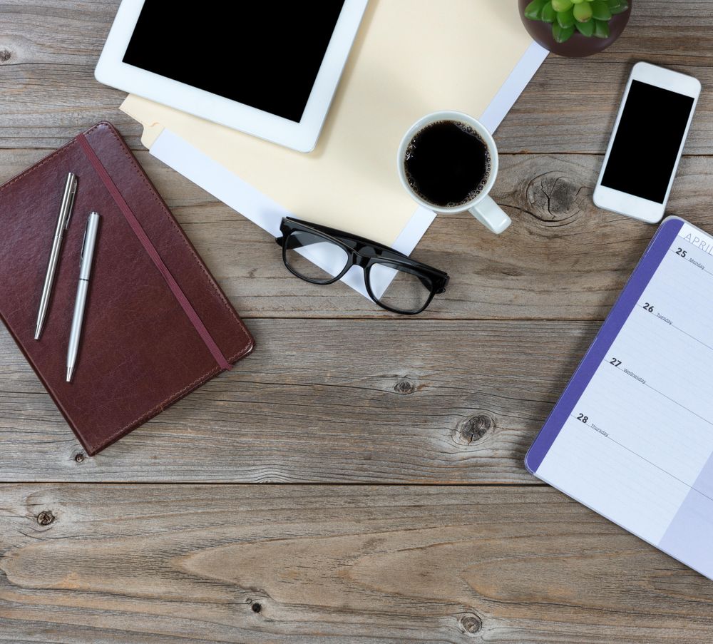 Desktop with a mixture of simple technology and traditional objects