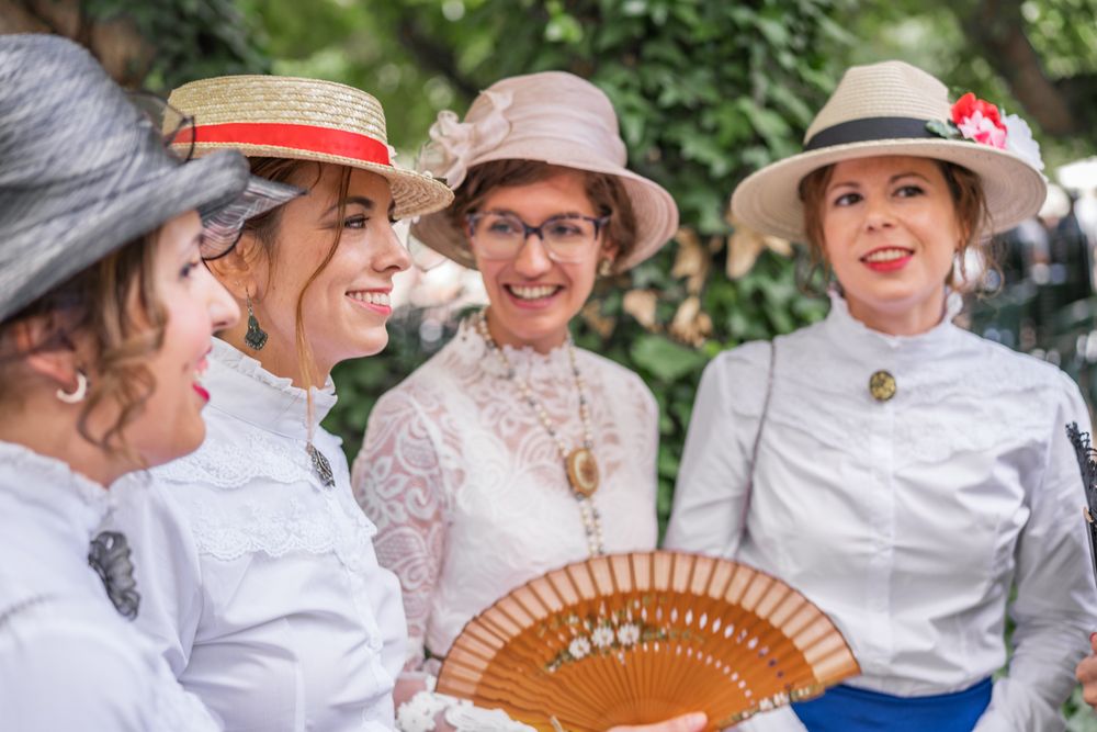 Vintage female friends speaking in garden