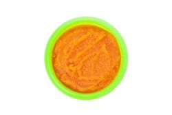 Bowl with healthy baby food isolated on plain background