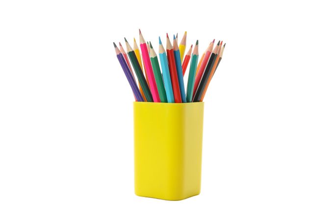 Yellow stand with pencils isolated on neutral background