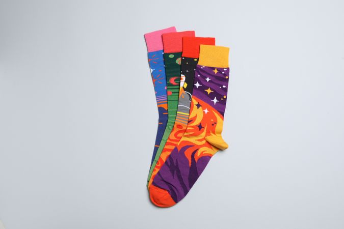 Casual clothes and wearing concept - socks, clothes for foot