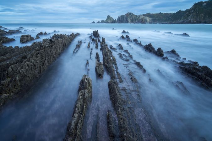 Foggy landscape of Playa de Gueirua rock seashore