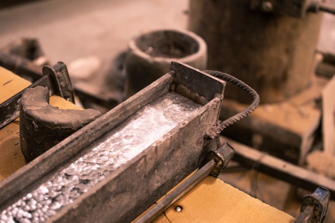 Heated metal in form on table