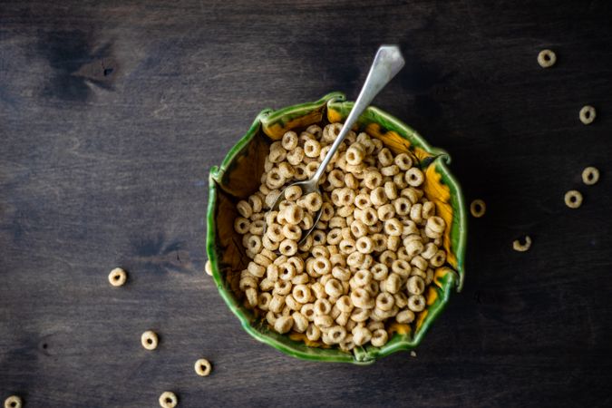 Top view of bowl of cereal on wooden table