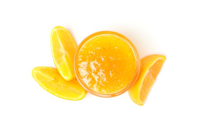 Delicious orange jam isolated on plain background