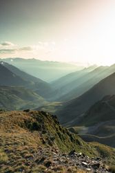 Mysterious mountain high in row in sunlight